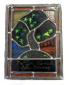 Stained and leaded glass panel depicting a tree and inscribed "20 years for John Harris Design