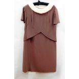 A brown crepe short-sleeved dress by Berliner, the cowl neck trimmed with white mink,