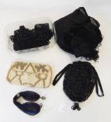 A black beaded evening bag, a miser's purse, a beaded cream evening bag,