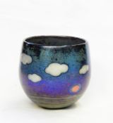 Siddy Langley glass lustre vase decorated with white clouds, on purple/blue lustre ground,