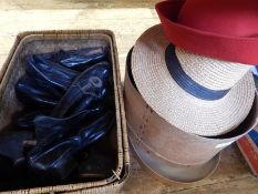 A quantity of early 20th century leather shoes and boots, a boxed bowler hat, a straw hat,