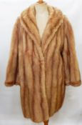 A vintage mink coat with bell sleeves,