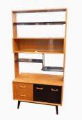 G-Plan light oak and ebonised shelf unit with glazed section, open shelves, drawers and cupboards,