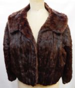 A vintage squirrel jacket labelled "Parisian Furriers,
