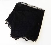 A length of black net material, possibly a curtain, together with a large wool throw, mauve,