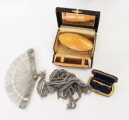 A guilloche enamel oval-shaped clothes brush with comb in original fitted box,