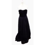 A strapless black evening gown with full lace skirt and black velvet ruched and boned bodice,