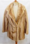 A pale mink jacket with extra pieces