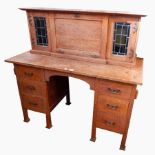 Arts and Crafts oak 'Stones' patent desk, with drop-down writing slope,