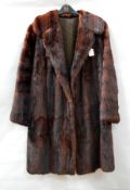 A vintage musquash coat together with a vintage fur coat labelled "The National Fur Company" (2)