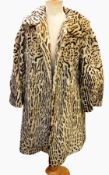 A faux-fur coat printed leopard skin pattern and a white faux-fur jacket labelled "Nylon Furleen"