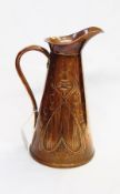 A copper water jug with floral decoration Joseph Sankey and Sons,