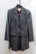A Hardy Amies grey wool skirt suit, a red and green check coat, a green wool bolero jacket,
