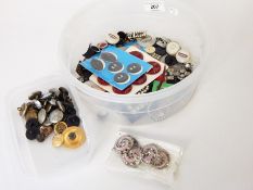 A quantity of loose buttons including Art Deco, pearl buttons, military buttons, etc.