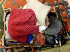 A quantity of gentlemens knitted waistcoats, tweed flat caps, braces, ties, trousers, etc.