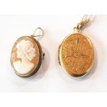 A 9ct gold locket, oval,