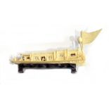 Japanese carved ivory houseboat on a carved wooden stand with two ivory animals,