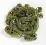 A Chinese carved spinach-jade stylised dragon symbol,