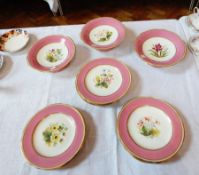 A Victorian china dessert service with painted rose and floral decoration to centre,