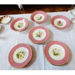 A Victorian china dessert service with painted rose and floral decoration to centre,