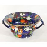 A Carltonware lustre two-handled bowl with handpainted decoration of fruits,