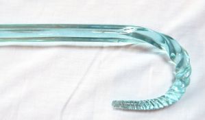 A glass walking cane, square form, the handle spirally twisted to a tapering point,