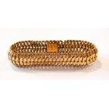 French gold-coloured metal mesh bracelet with petal design, 22.7g approx.