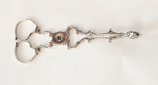 A Georgian silver pair of sugar tongs, C-scroll pattern, marks rubbed,