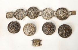 A foreign silver bracelet with cherub head and bird medallions together with four similar buttons