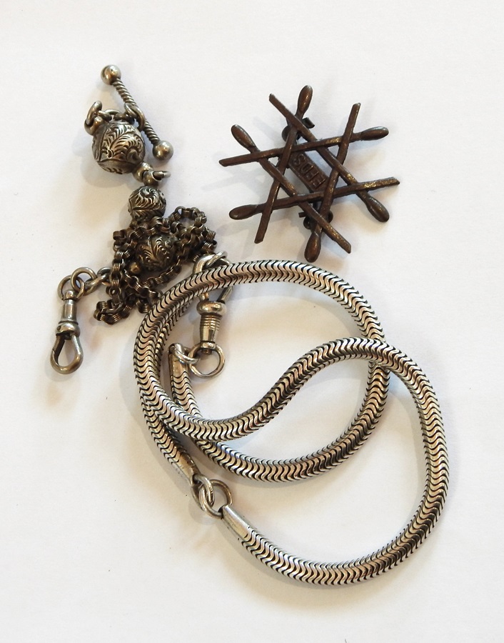 Silver-coloured watch chain with T-bar, engraved ball and chain pattern,