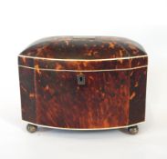 A 19th century bow-front tortoiseshell tea caddy, the top with inset engraved plate,