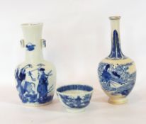A Chinese porcelain bottle vase with underglaze blue decoration of figure on buffalo,