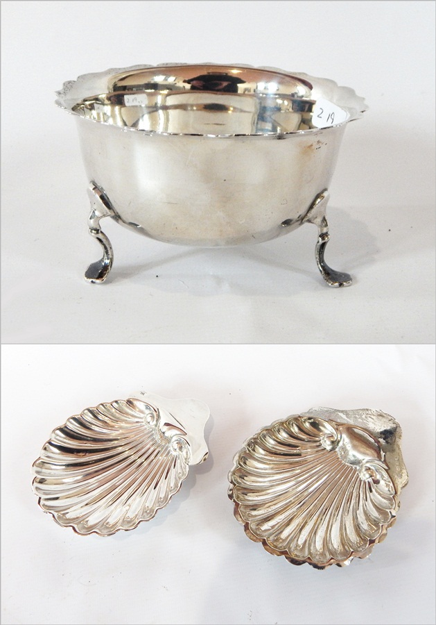 A late Victorian silver sugar bowl with cut card borders, plain form, raised on pad feet,