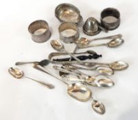 A quantity of small silver items to include napkin rings, teaspoons, tea strainer, etc.