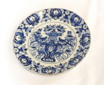 A pair of antique blue and white Delft plates with handpainted floral and bird decoration, 26.