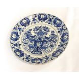 A pair of antique blue and white Delft plates with handpainted floral and bird decoration, 26.