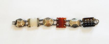 Victorian silver and agate bracelet having three carved scalloped and shaped rectangular agate