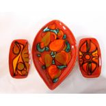 A Poole Delphis pattern oval-shaped dish, orange, green and turquoise on an orange ground,