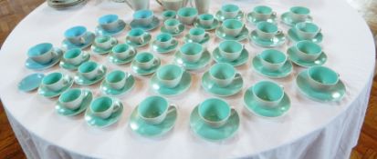 A large quantity of Poole turquoise and grey teacups and saucers (15), coffee cups and saucers (20),