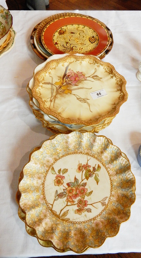 A quantity of Doulton china dessert plates with handpainted floral and gilt pattern