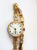 Lady's 9ct gold wristwatch circular with subsidiary seconds dial,