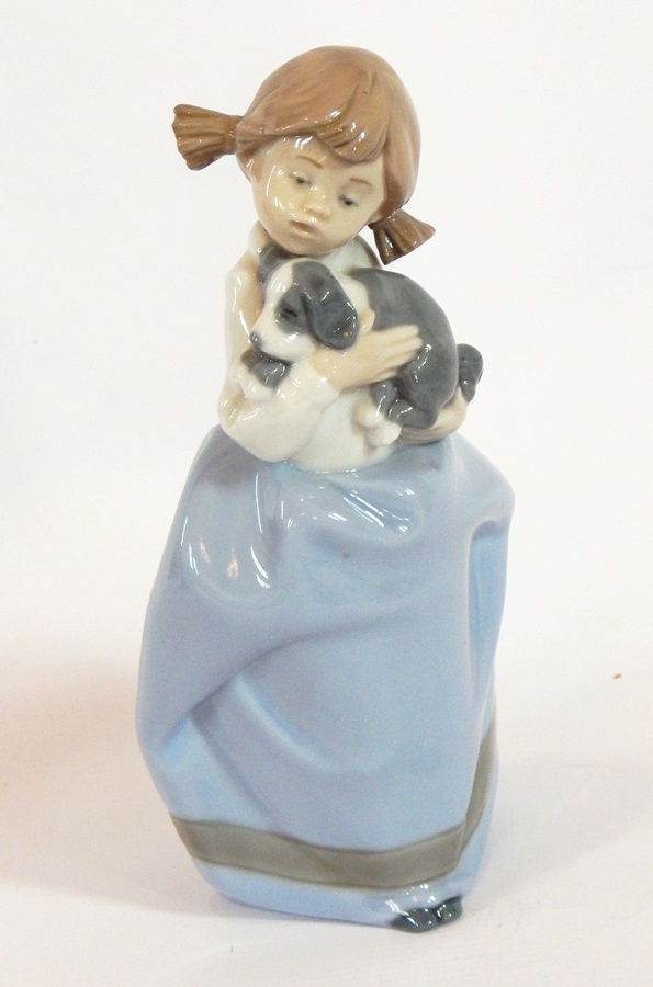 A Nao model by Lladro of a young girl holding a puppy, - Image 2 of 2