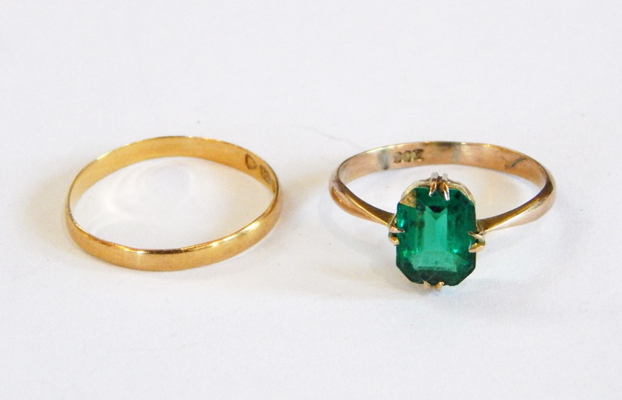 22ct gold fine wedding ring and a 9ct dress ring set with green stone