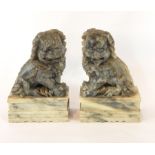 A pair of carved soapstone Dogs of Fo bookends,