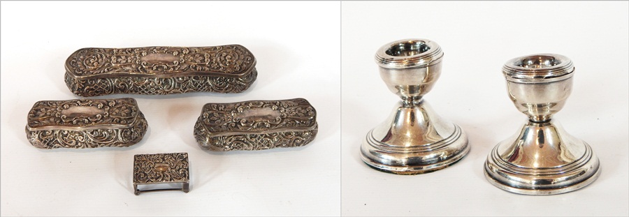 An Edwardian silver dressing table set with foliate C-scroll repousse decoration of three matching
