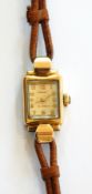 Lady's Rotary 9ct gold wristwatch in rectangular case with raised arch glass face