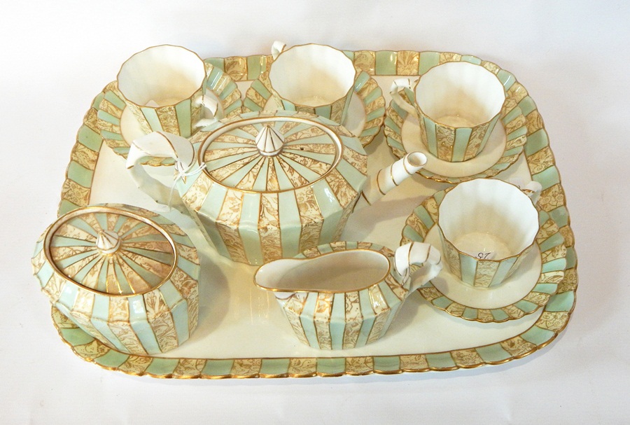 Edwin Bodley china cabinet set in pale green and gold scroll panel decorated including teapot and