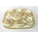 Edwin Bodley china cabinet set in pale green and gold scroll panel decorated including teapot and