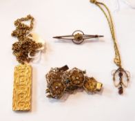 A 9ct gold and blue stone bar brooch, a 9ct gold openwork seedpearl and amethyst pendant,