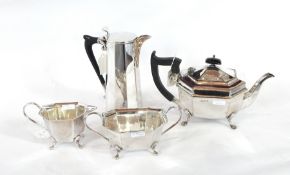 A silver-plate three-piece tea service, of tapering faceted form comprising teapot,